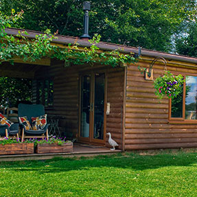 Exterior showing the beautiful roses and hanging baskets